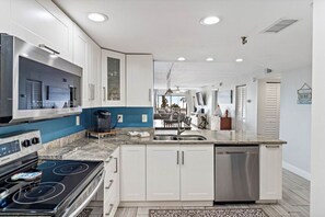 Fridge, microwave, oven, stovetop - Across from Madeira Beach – Gulf-View Condo with Pool (Madeira Beach)