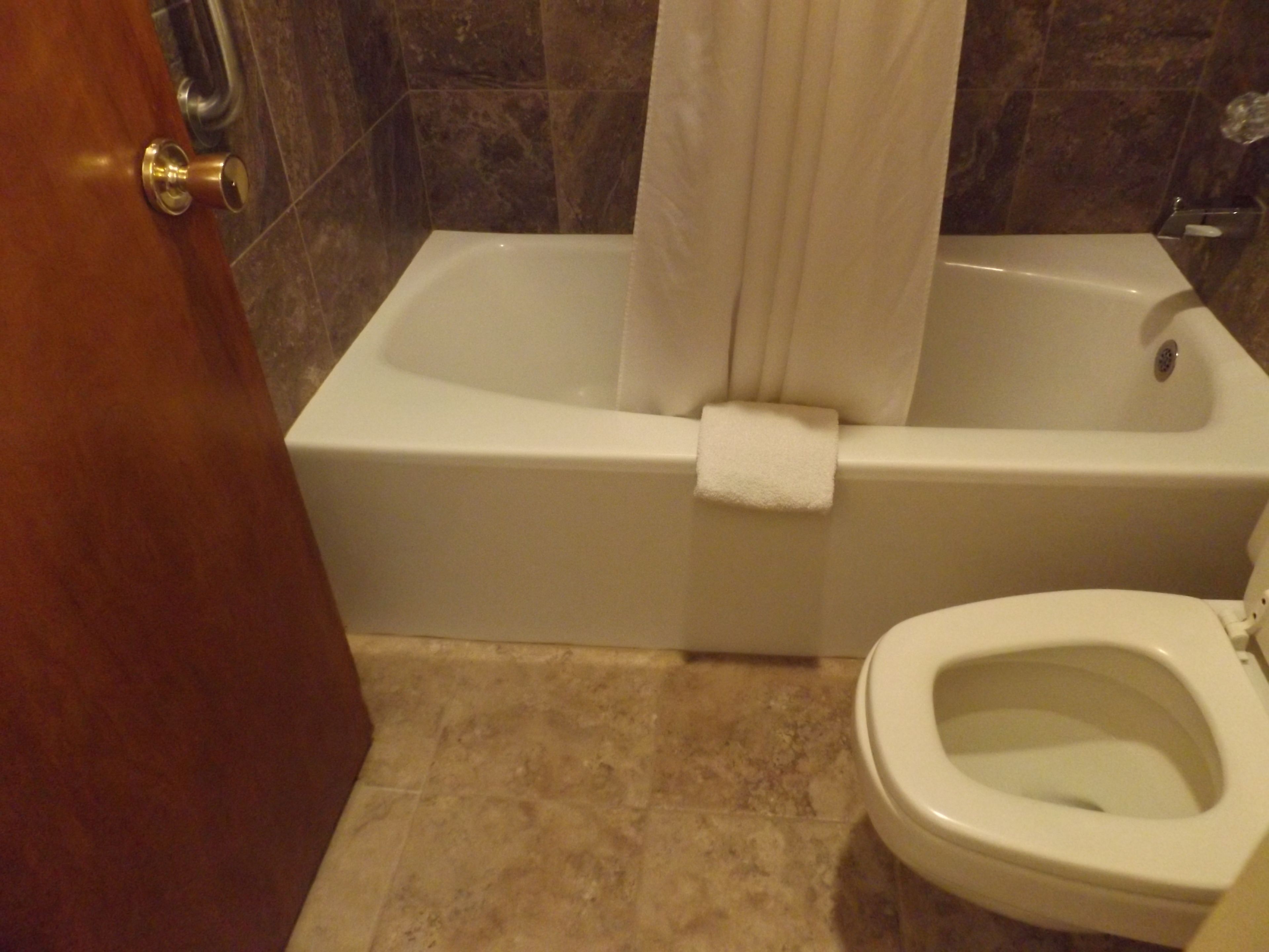 superior room, 2 double beds, non smoking, kitchenette | bathroom | combined shower/bathtub, deep-soaking bathtub, free toiletries