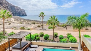 A pool area with a view of the beach and ocean. - ..it's your place!... (Los Cristianos)