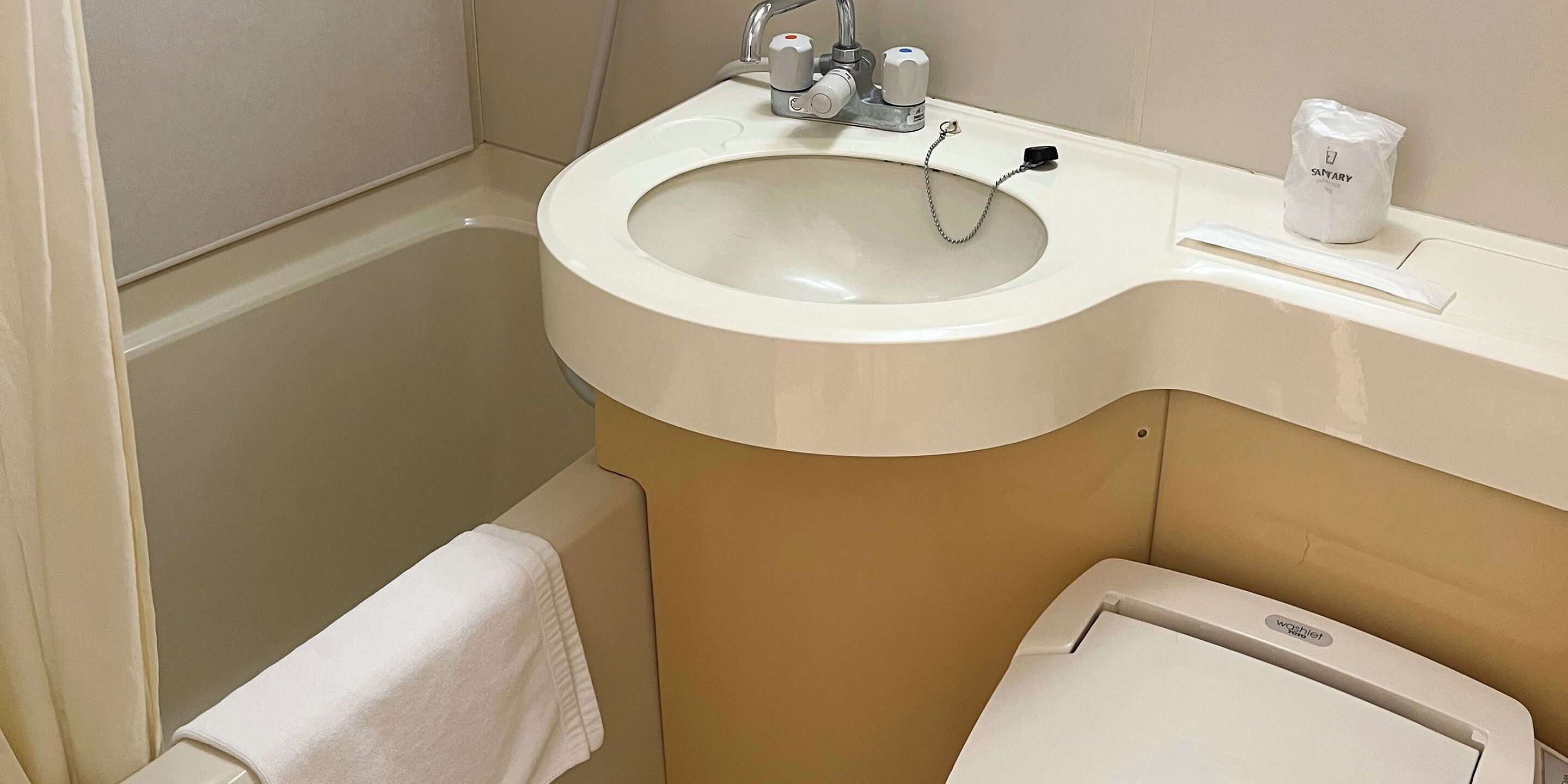 Combined shower/tub, free toiletries, hair dryer, slippers