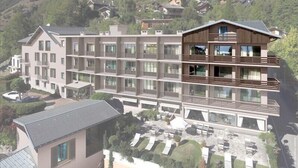 A multi-story hotel with a modern design, featuring balconies and large windows.