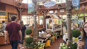 An indoor market with wooden beams, potted plants, and various stalls. - Lake Front Property on the main channel of Barkley Lake-Private Paradise (Eddyville)