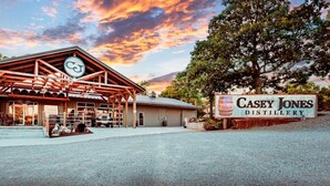 A rustic building with a large sign for Casey Jones Distillery. - Lake Front Property on the main channel of Barkley Lake-Private Paradise (Eddyville)