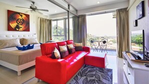 Deluxe Apartment, King Bed, Balcony, Seaview | Living area | 32-inch LCD TV with cable channels, TV