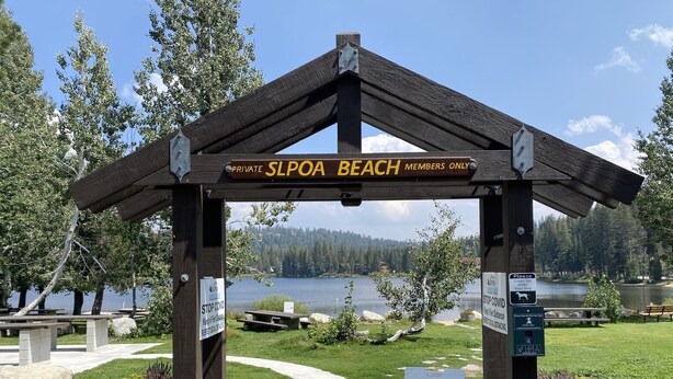 A private beach entrance with a wooden archway labeled "SLOPA BEACH MEMBERS ONLY". - Lakeview Capone Getaway, great sledding on property, fun loft for kids, Lg deck (Soda Springs)