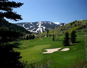 Enjoy a round of golf amidst the serene mountains and lush greenery.