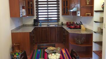 Fridge, microwave, stovetop, coffee/tea maker