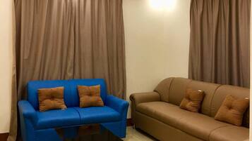 Entire Family Bungalow 3 bedrooms | Living room | 55-inch flat-screen TV with satellite channels, Smart TV, DVD player