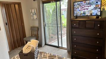 1 bedroom, desk, iron/ironing board, travel crib