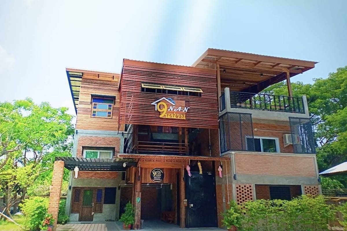 A two-story building with a prominent sign for '9 Nand Restaurant'.