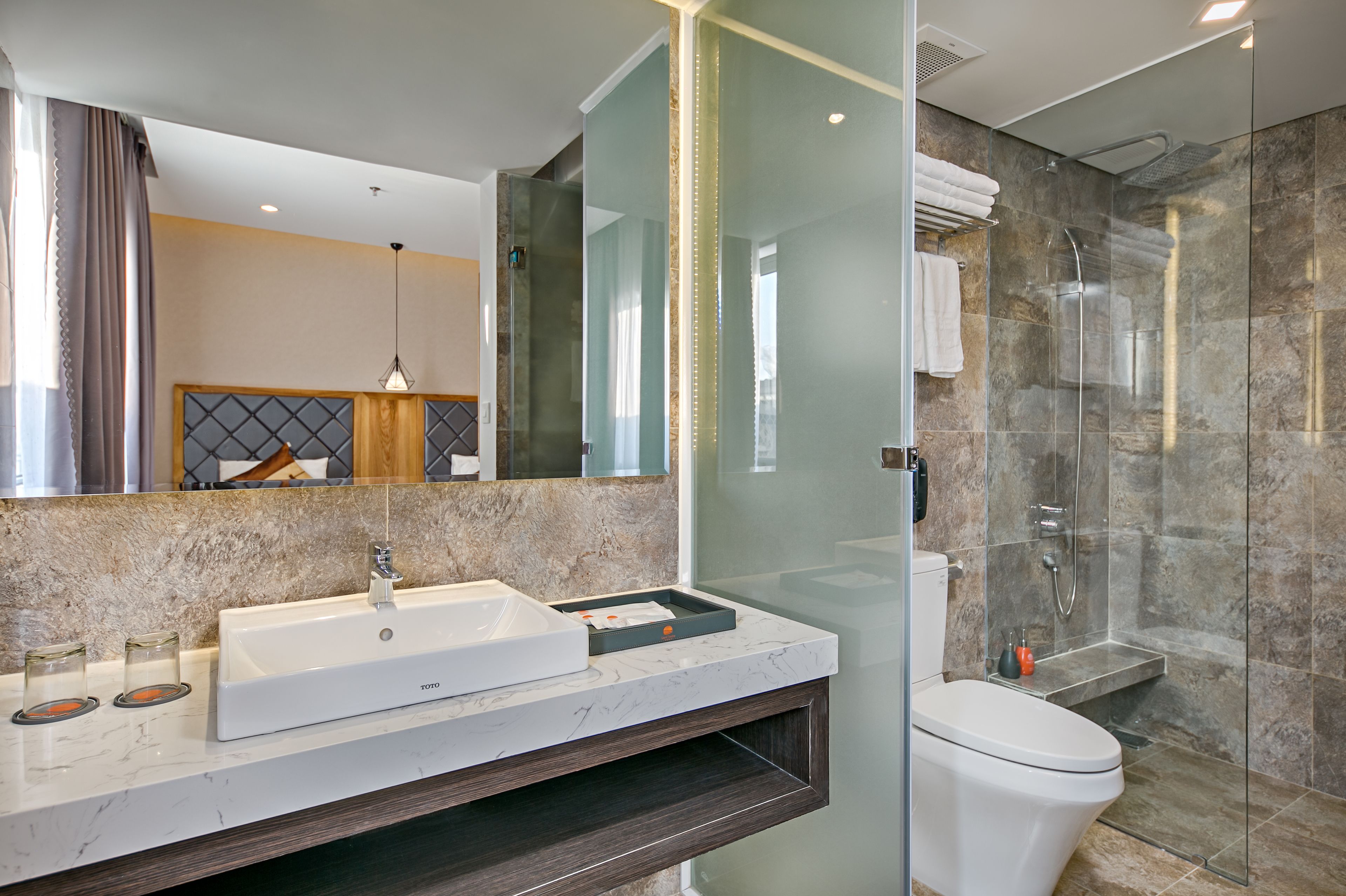 deluxe triple room | bathroom | rainfall showerhead, free toiletries, hair dryer, bathrobes