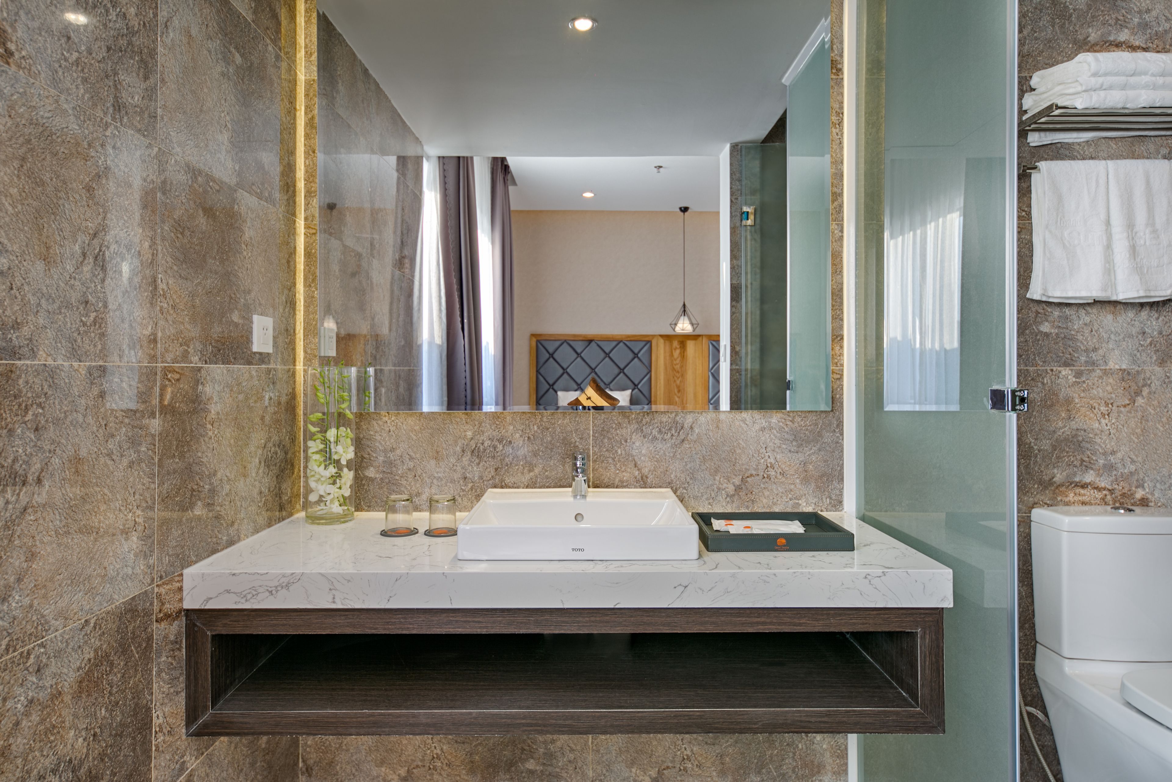 deluxe triple room | bathroom | rainfall showerhead, free toiletries, hair dryer, bathrobes