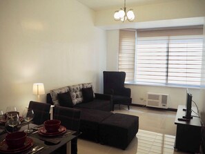 Condo, 1 Bedroom | Living area | 45-inch LED TV with cable channels, TV - Amazing Marina Residential Suites (Manila)