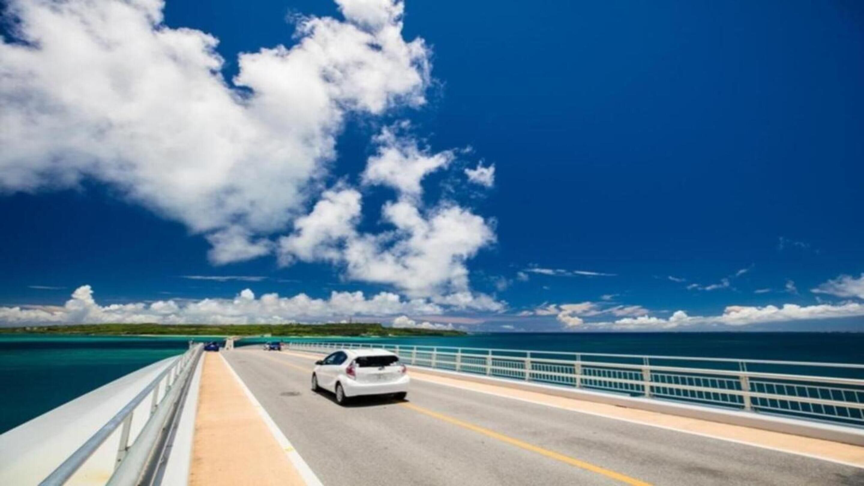 A bridge with a road and a car.