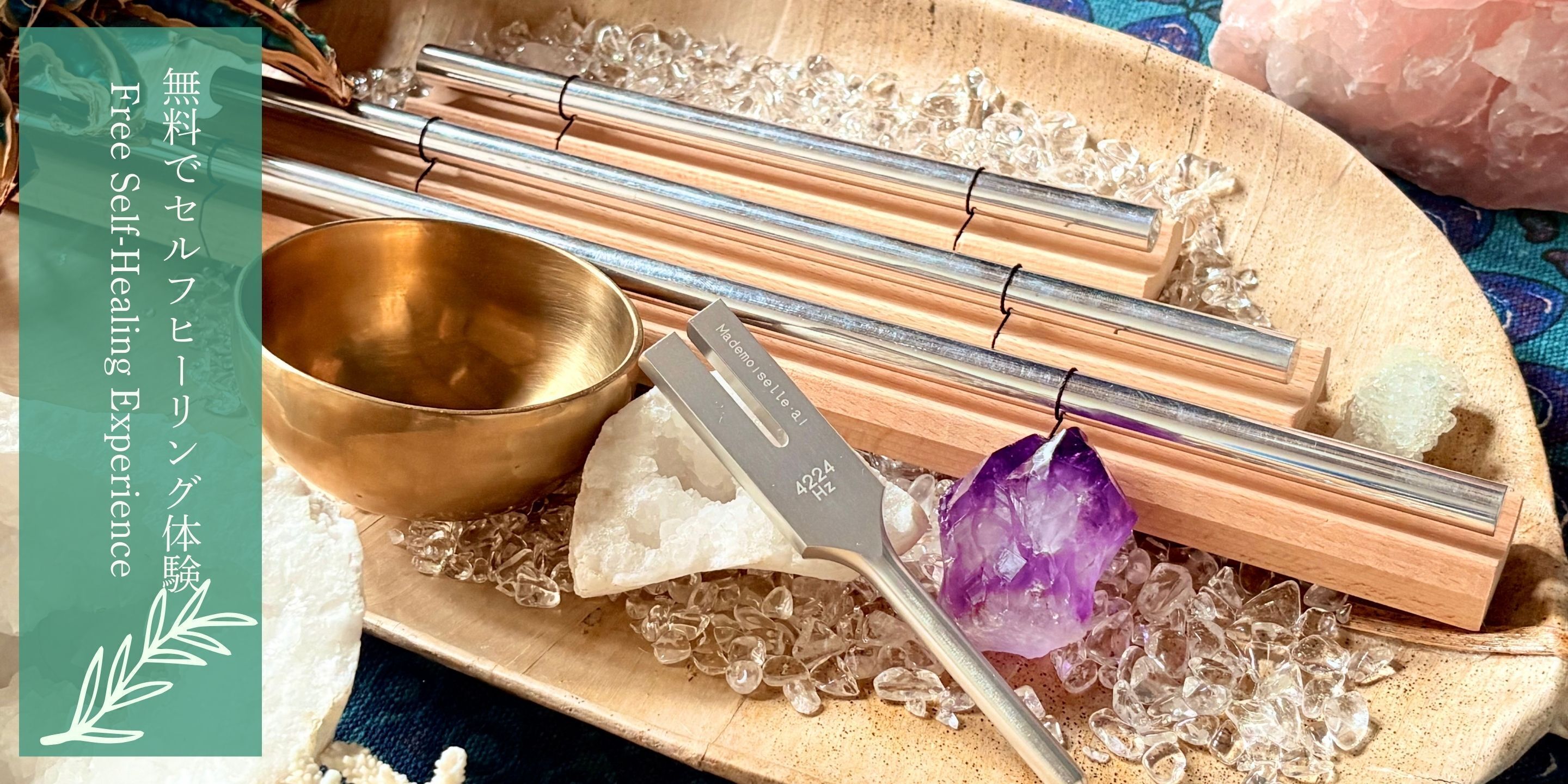 A meditation setup with a bowl, crystals, and a tuning fork.