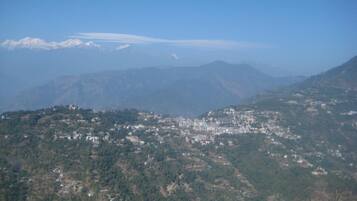A mountainous landscape with a town nestled in the valley.