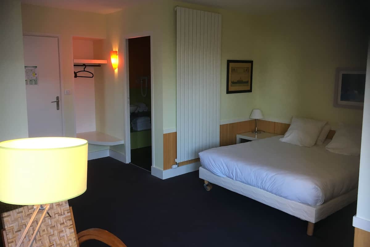 Suite, 2 Bedrooms, Garden View | Desk, blackout curtains, soundproofing, iron/ironing board (on request)