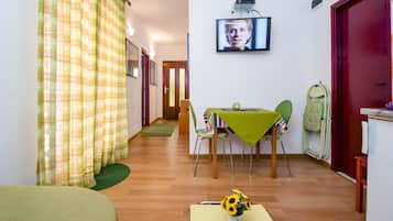 Groundfloor apartment Aja | Living area | 60-cm flat-screen TV with satellite channels, TV