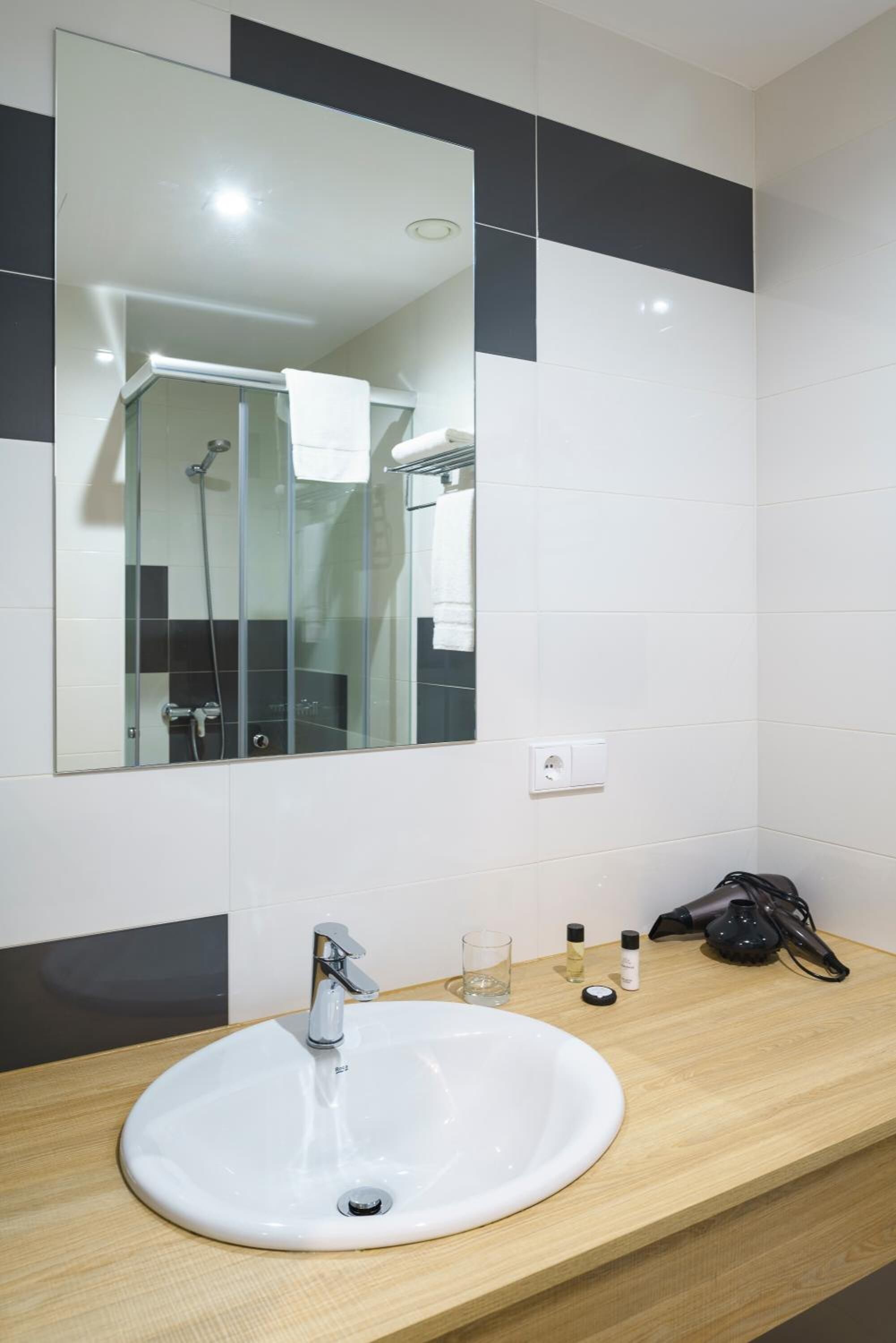 shower, designer toiletries, hair dryer, towels