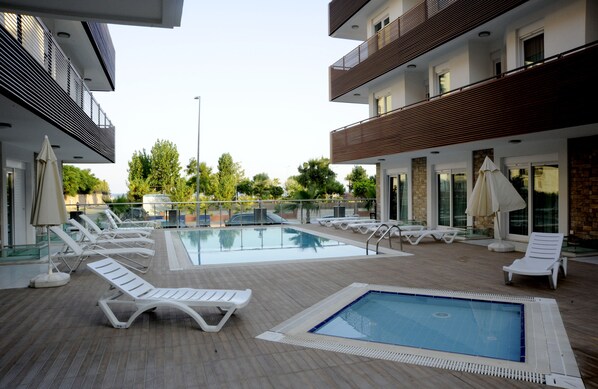 Outdoor pool, pool umbrellas, pool loungers