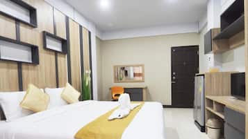 Quarto superior, 1 cama King | Escrivaninha, cortinas blackout, Wi-Fi de cortesia, roupa de cama