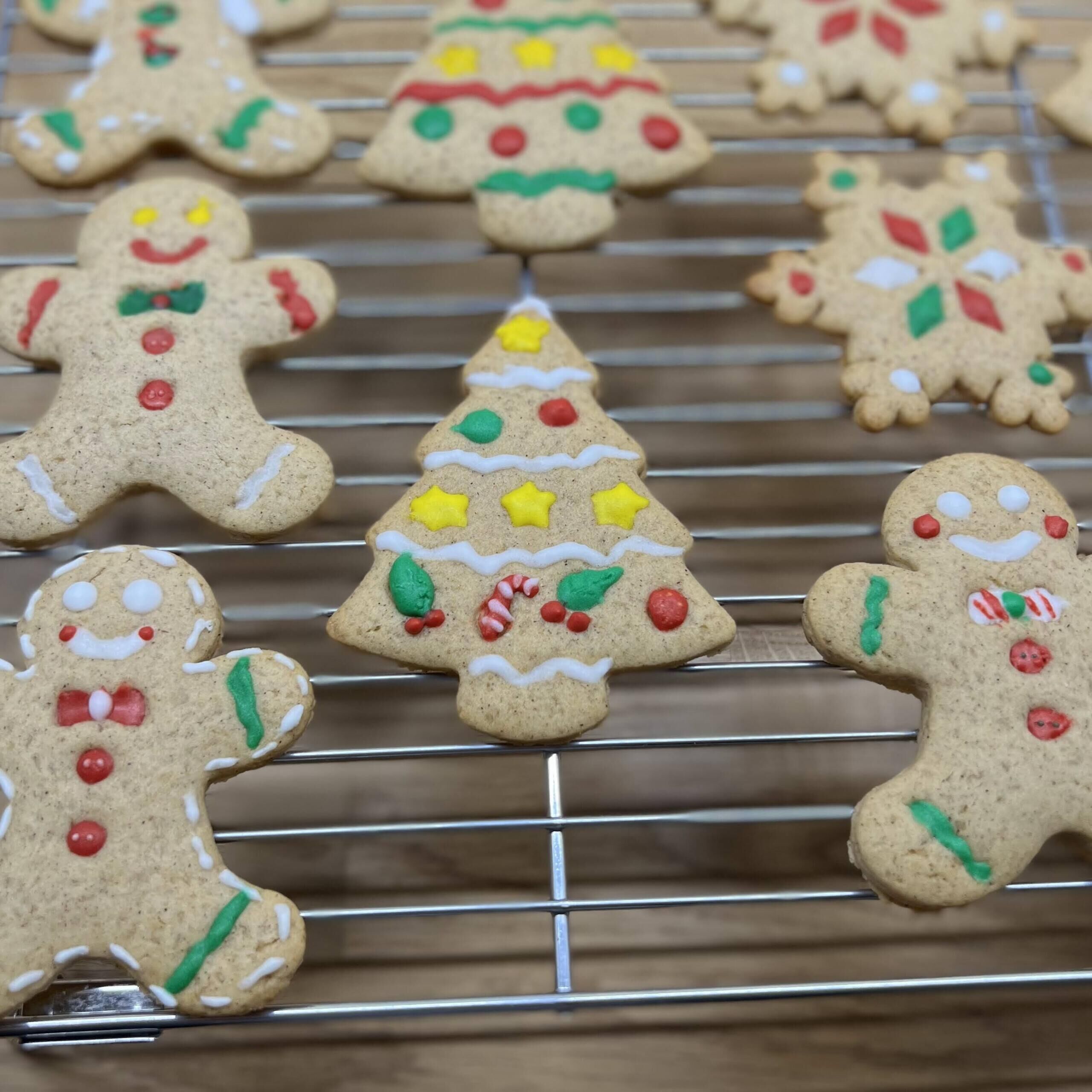 Gingerbread cookies on a wire rack.