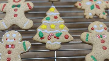 Gingerbread cookies on a wire rack.