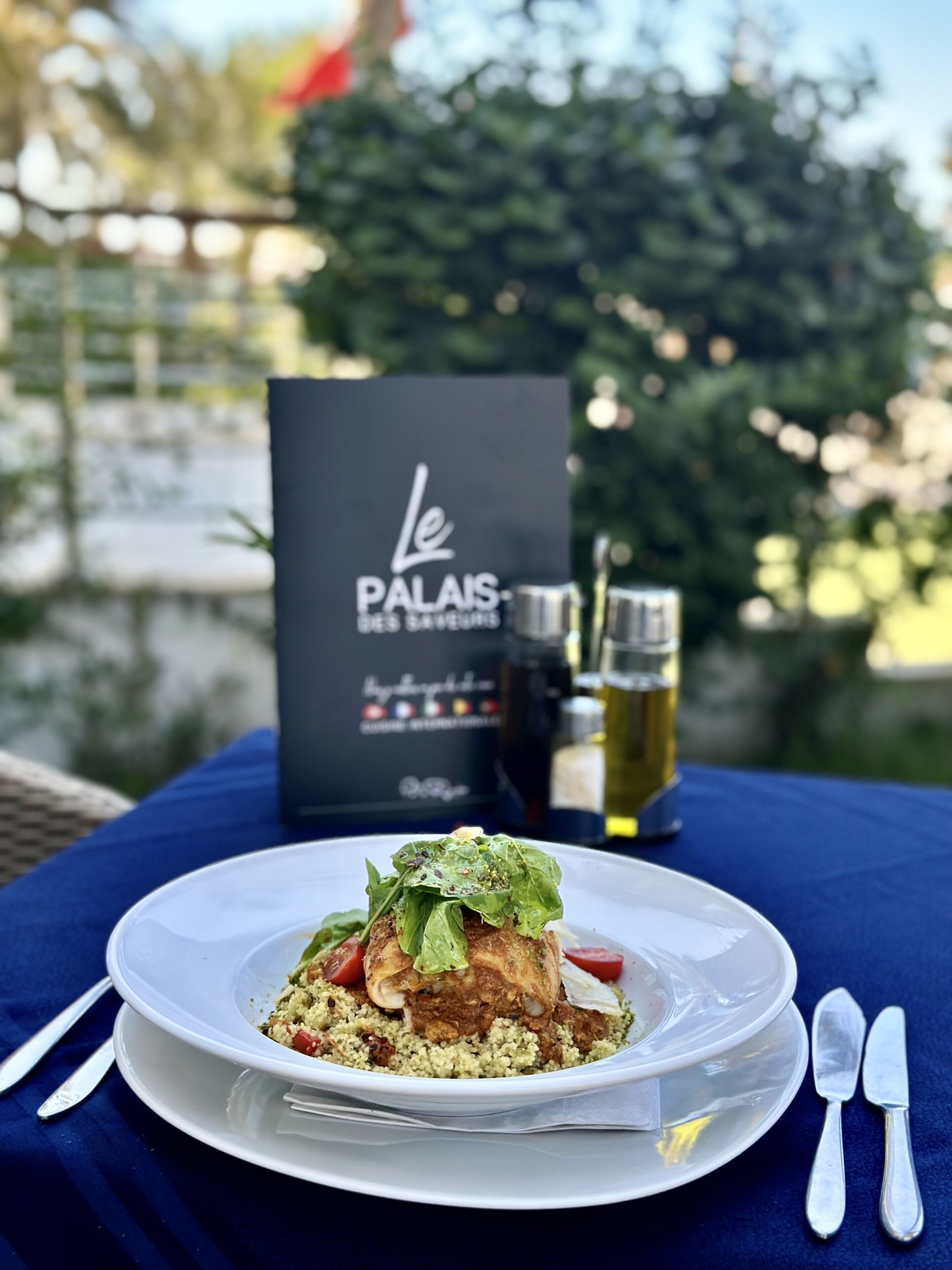 A plate of food with a black sign in the background.