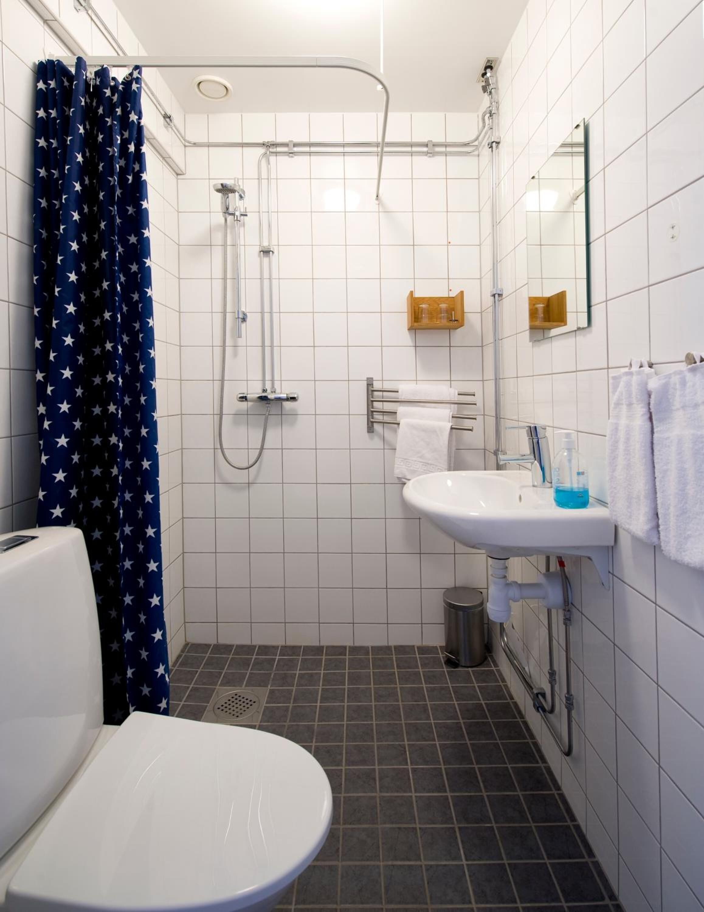 shower, designer toiletries, hair dryer, towels