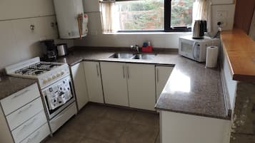 Superior Bungalow, 2 Bedrooms | Private kitchen | Fridge, microwave, oven, stovetop