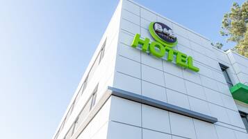 A hotel sign with the name "B&B Hotels" and the word "HOTEL" in large green letters.
