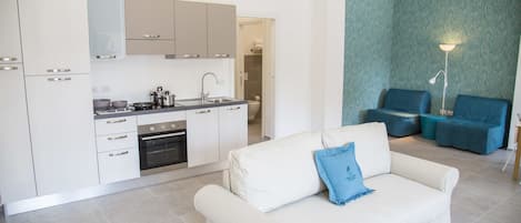 Comfort Apartment, 1 Bedroom | Living room | Flat-screen TV