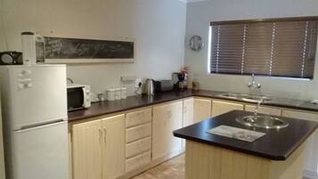 Comfort Cottage, 3 Bedrooms | Private kitchen | Full-size fridge, microwave, toaster, cookware/dishes/utensils