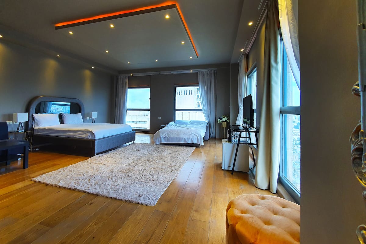 luxury room, city view | desk, laptop workspace, soundproofing, iron/ironing board