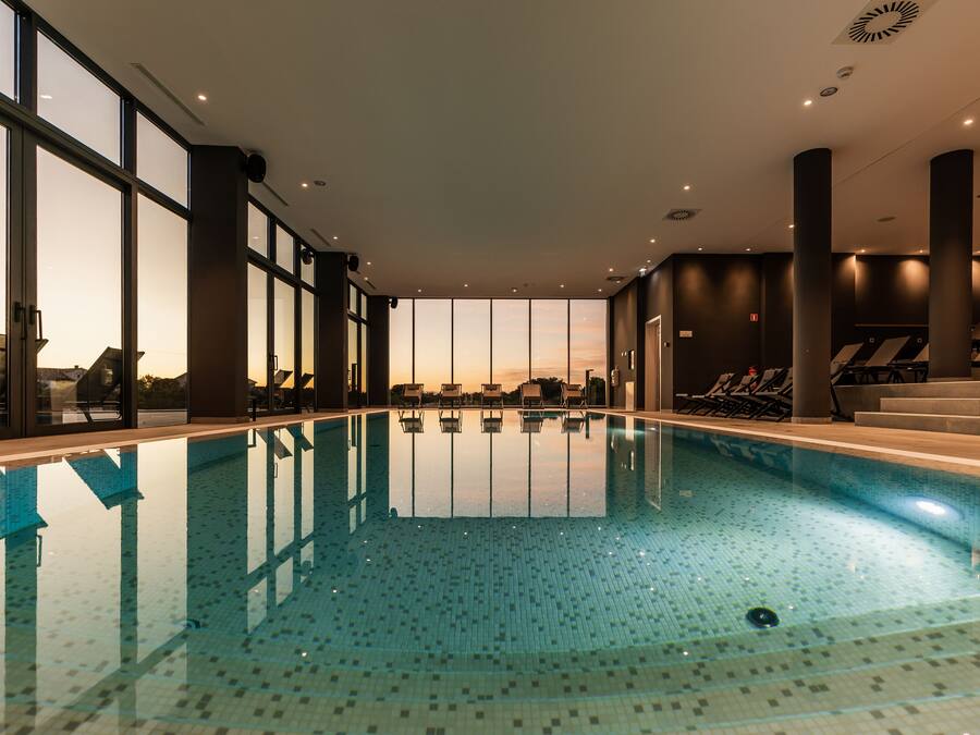 Indoor pool, outdoor pool, pool umbrellas, pool loungers