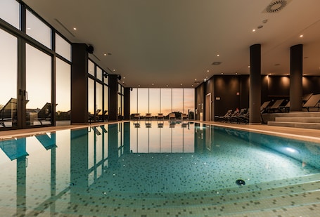 Indoor pool, outdoor pool, pool umbrellas, sun loungers