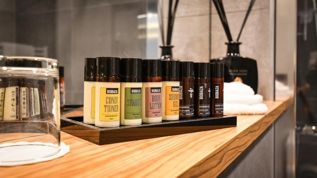 A wooden counter with a selection of Biobaza body care products.