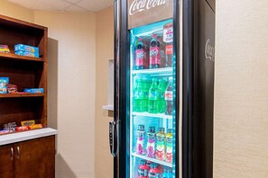 A vending machine with various beverages and snacks. - Comfort Inn and Suites (Fredericksburg)