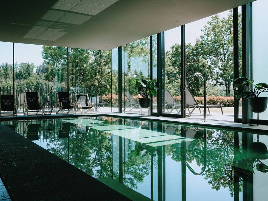 Indoor pool, open 8:00 AM to 8:00 PM, pool umbrellas, pool loungers