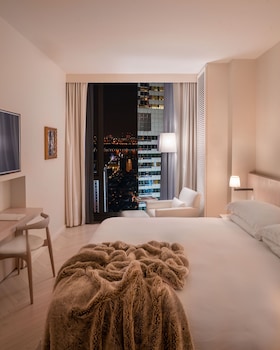 Hypo-allergenic bedding, down comforters, pillowtop beds, minibar at The Times Square EDITION