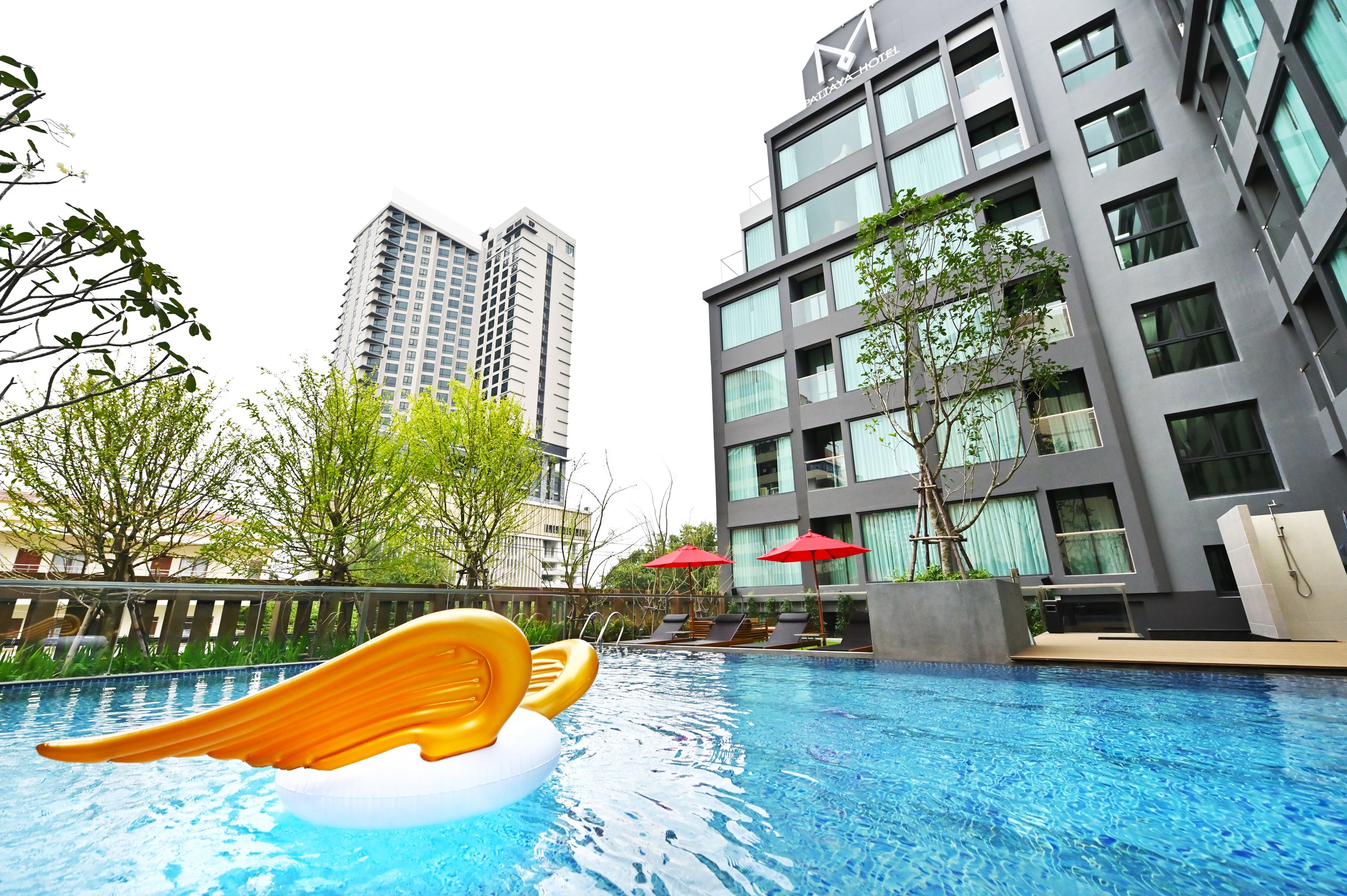 outdoor pool, pool umbrellas, pool loungers