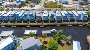 A coastal residential area with beachfront properties, a marina, and a beach. - Gulf View, Gated Community with Pool, WiFi ~ Waterside Village Condo 302 (Mexico Beach)
