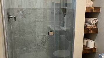 Combined shower/tub, hair dryer, towels, soap