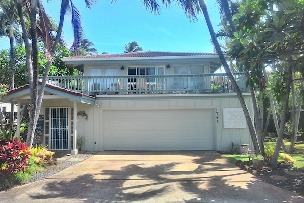 Front of the house with large deck over the garage.