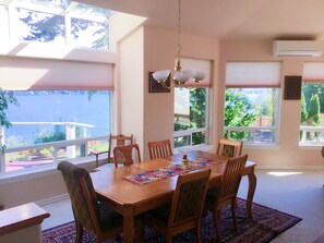 Enjoy meals with family and friends in this spacious dining area, complete with a large table and comfortable chairs.