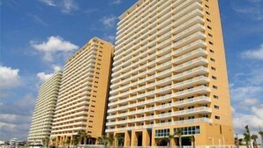 Two high-rise buildings with multiple balconies, likely part of a hotel or residential complex. - 4th Floor! ☼☼❀❀ 2BR/2BA,Sleeps 6,Handicap Acc,Living & Mstr Rms Facing The Beach (Panama City)