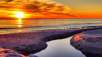 On the beach, sun-loungers