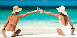 On the beach, sun-loungers