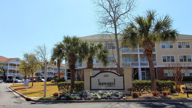A residential building with a sign reading "Ironwood." - Ironwood Apartment 1722 (North Myrtle Beach)