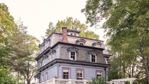 A large, multi-story house with a balcony and a swimming pool. - The Bevin House Bed & Breakfast (East Hampton)
